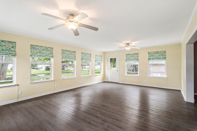 interior space featuring crown molding, ceiling fan, and dark hardwood / wood-style flooring