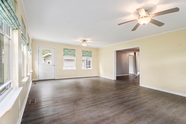 unfurnished living room featuring dark wood-type flooring, ceiling fan, and ornamental molding