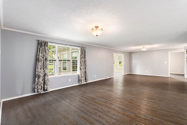 spare room with crown molding, dark hardwood / wood-style flooring, and a textured ceiling