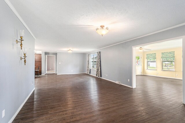 empty room with crown molding, a textured ceiling, ceiling fan, and dark hardwood / wood-style floors