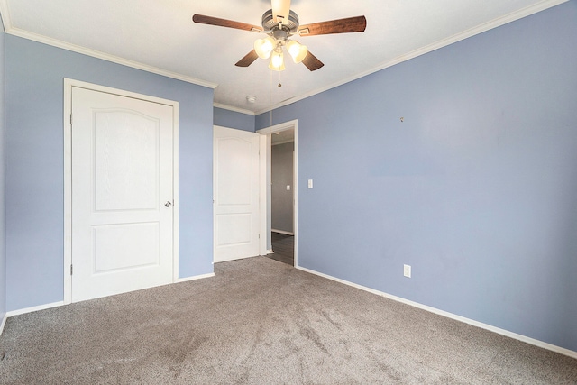 unfurnished bedroom with crown molding, ceiling fan, and carpet floors