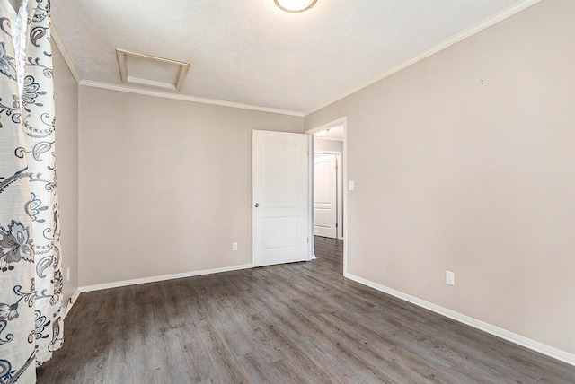 unfurnished room with a textured ceiling, crown molding, and dark hardwood / wood-style flooring