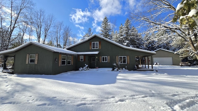 view of front of property with an outbuilding and a garage