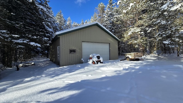 view of snow covered garage