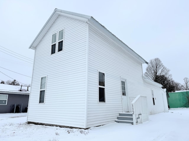 view of snow covered house