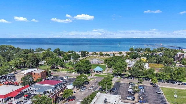 birds eye view of property with a water view