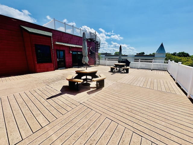 wooden deck featuring outdoor dining area