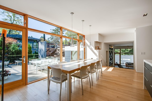 dining space featuring light wood-type flooring