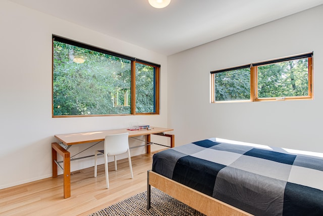 bedroom with wood-type flooring