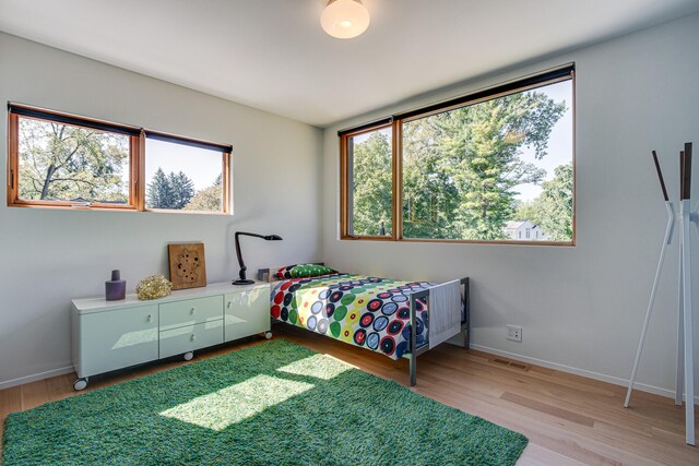 bedroom with light hardwood / wood-style flooring