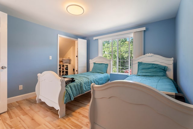 bedroom with light hardwood / wood-style floors