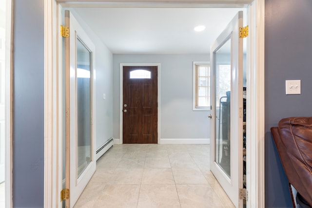 tiled entryway featuring a baseboard radiator