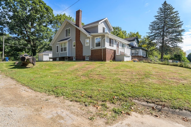 view of home's exterior with a lawn