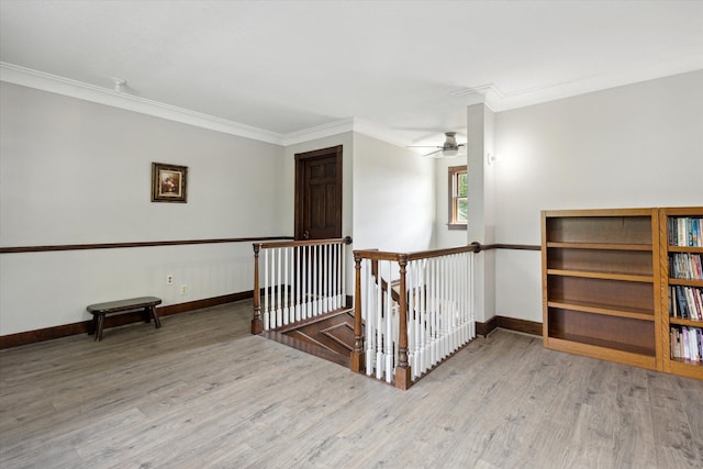 interior space featuring crown molding, ceiling fan, and hardwood / wood-style floors