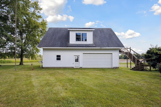 view of side of home with a garage and a lawn