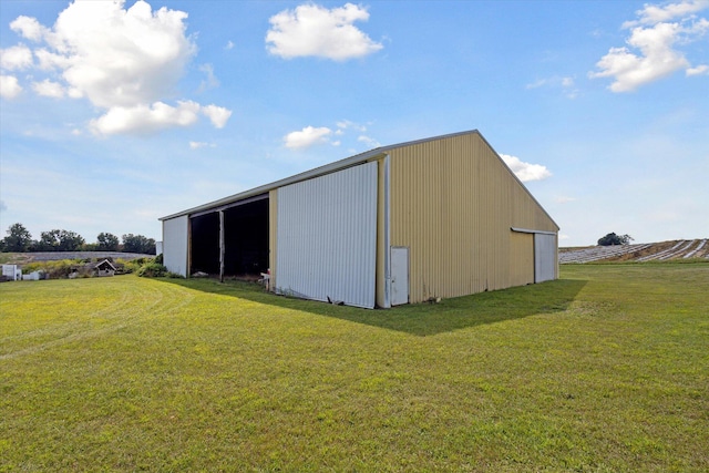 view of outbuilding featuring a lawn