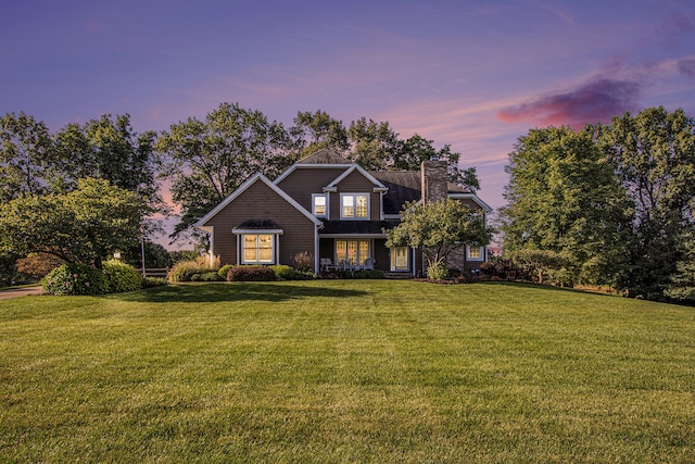 view of front of home with a lawn