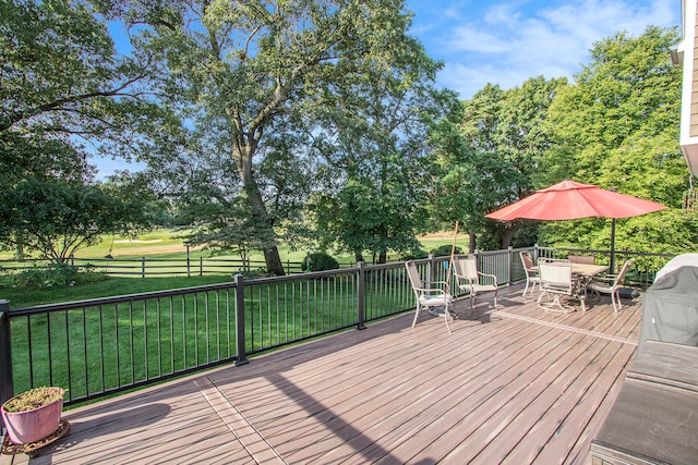 wooden terrace with a lawn