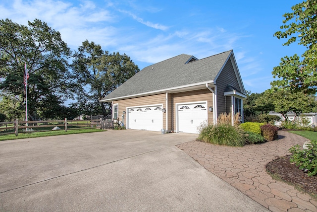 view of side of home with a garage