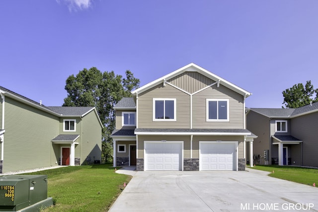 view of front of property featuring stone siding, driveway, an attached garage, and a front yard