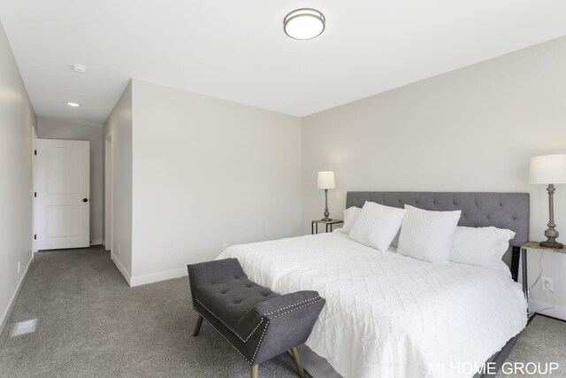 carpeted bedroom featuring lofted ceiling