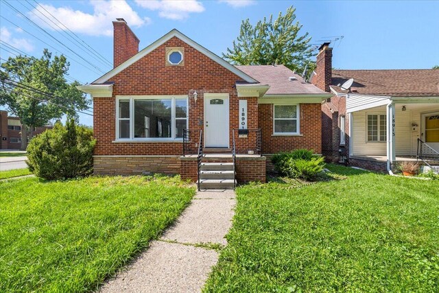 bungalow with a front lawn