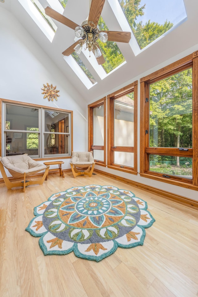 interior space featuring plenty of natural light, a skylight, and wood-type flooring