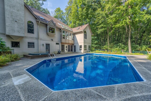 view of swimming pool with a patio area