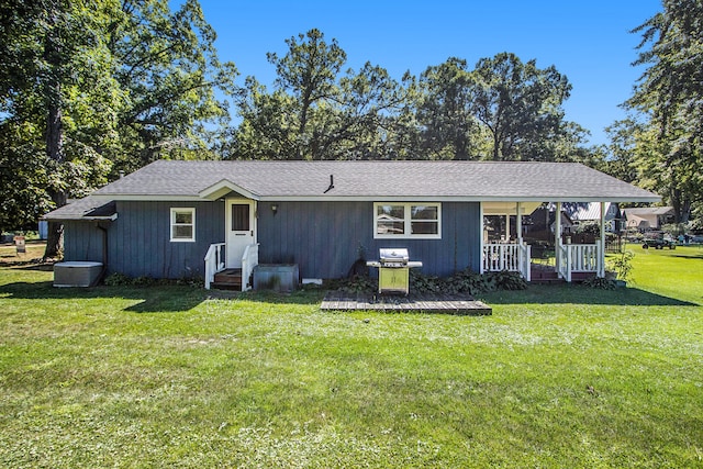 ranch-style house with a front lawn