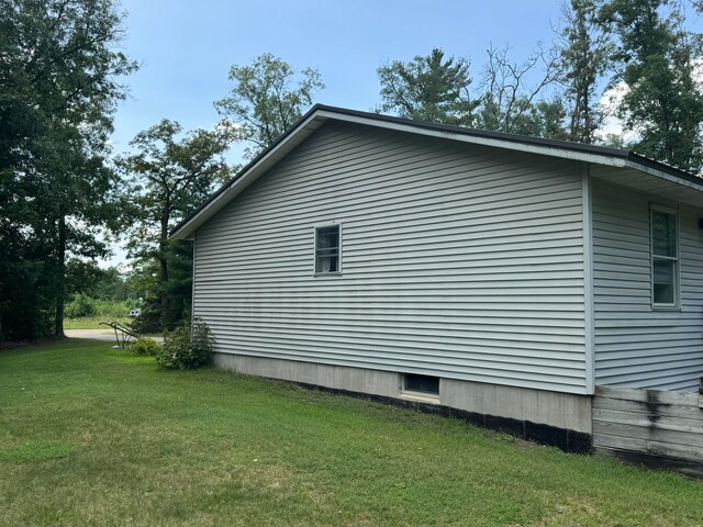 view of property exterior featuring a yard