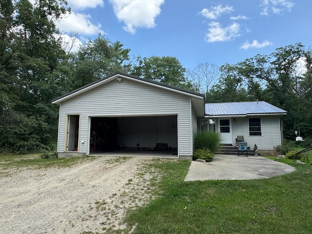 exterior space featuring a garage and a front yard