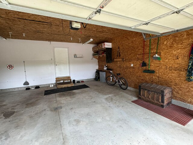 garage featuring a garage door opener