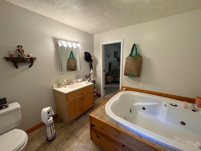 bathroom featuring toilet, a tub, tile patterned flooring, vanity, and a textured ceiling