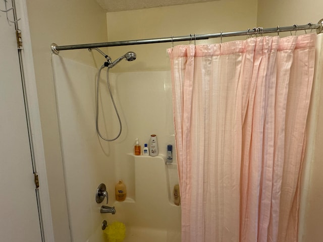 bathroom featuring shower / bathtub combination with curtain