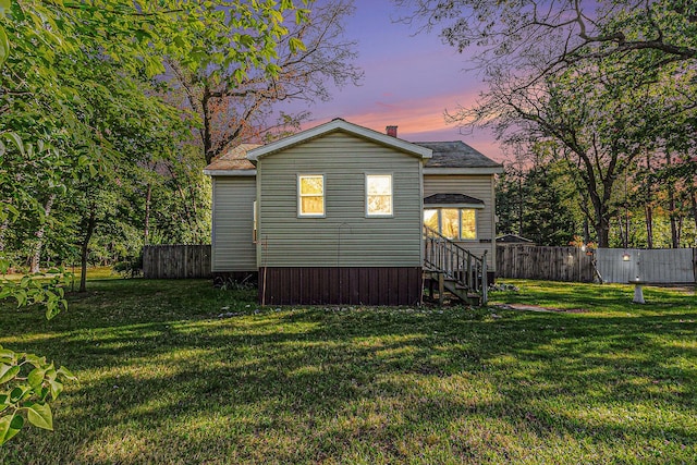 6991 E Apple Ave, Muskegon, MI 49442 - back of property with a yard and fence