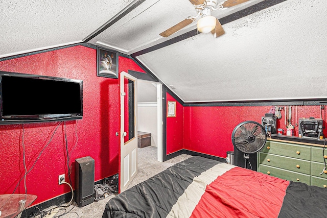 6991 E Apple Ave, Muskegon, MI 49442 - bedroom with vaulted ceiling, a textured wall, a textured ceiling, a ceiling fan, and carpet floors