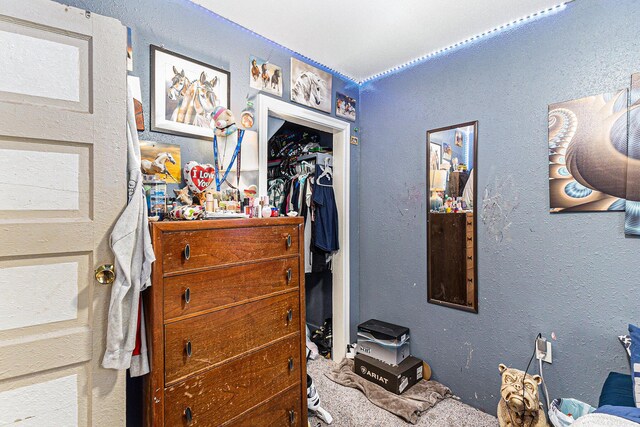6991 E Apple Ave, Muskegon, MI 49442 - carpeted bedroom featuring a textured wall