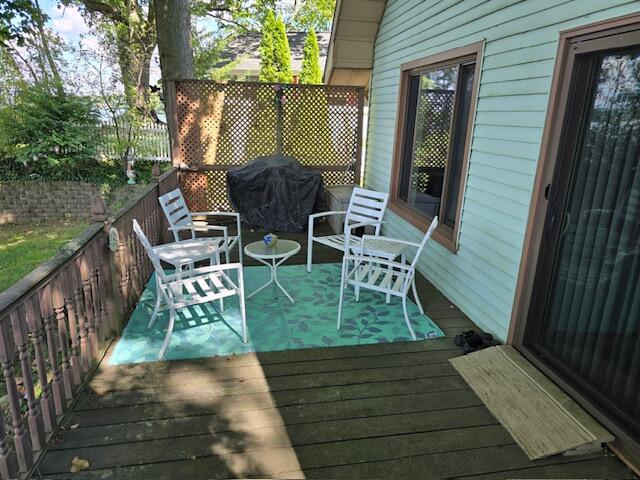 wooden terrace with area for grilling