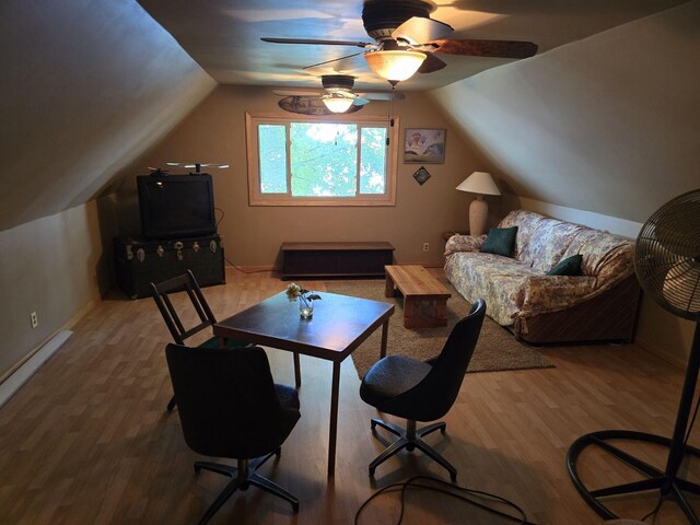 office featuring ceiling fan, wood-type flooring, and vaulted ceiling