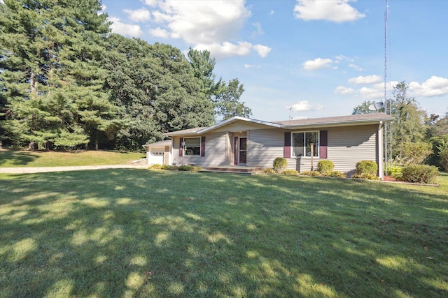 single story home with a front yard and a garage