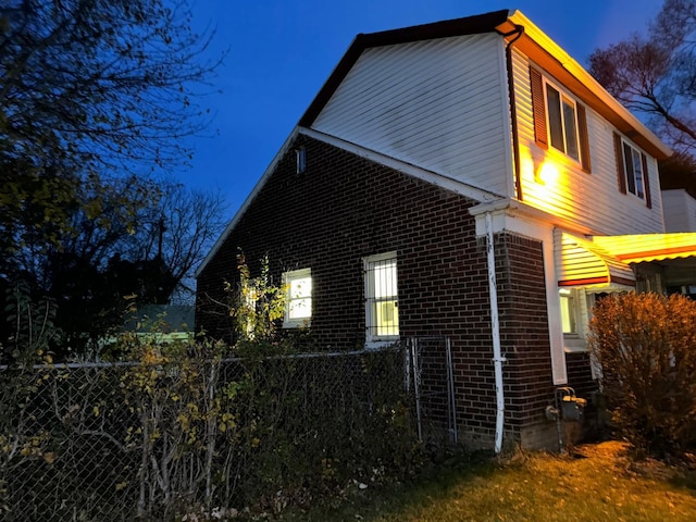 view of property exterior at twilight