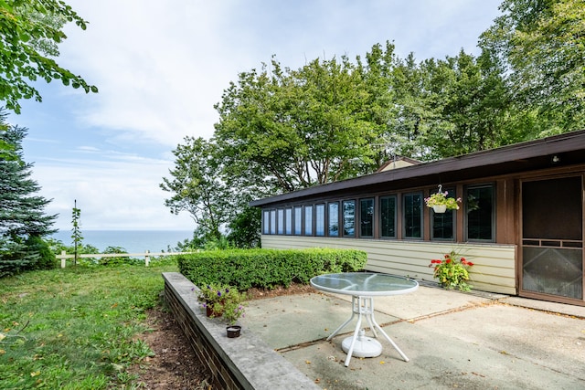 view of patio / terrace with a water view