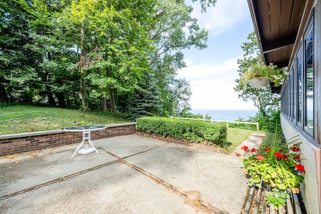 view of patio featuring a water view