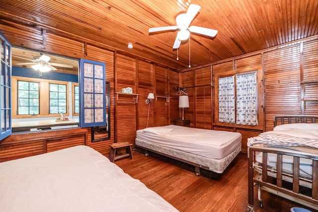 bedroom with wooden ceiling and wood finished floors