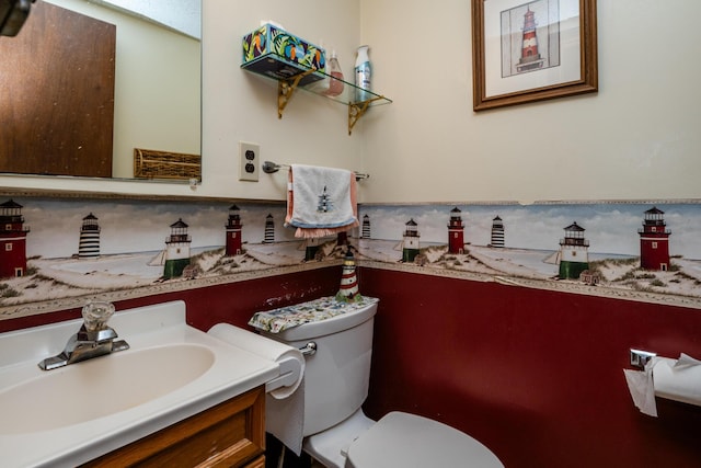 bathroom featuring toilet and vanity