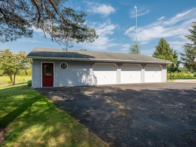 garage with a yard