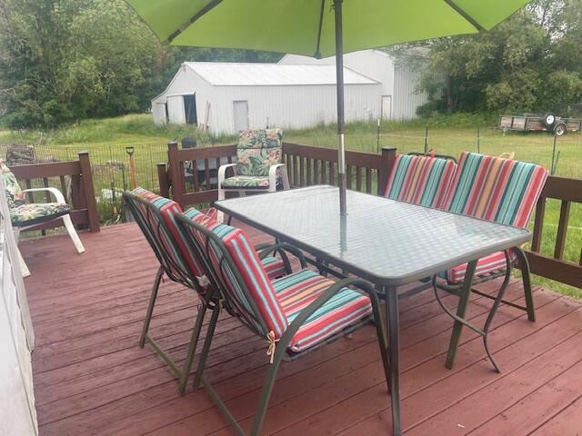 wooden deck featuring a yard