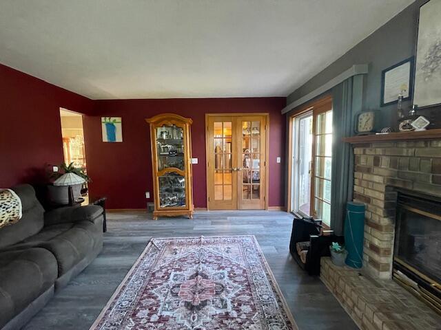 living room featuring a fireplace and hardwood / wood-style flooring