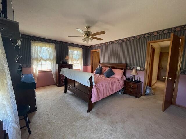 bedroom with carpet flooring and ceiling fan