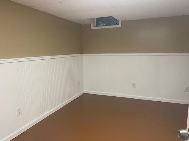 unfurnished room with a paneled ceiling